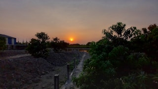 Sunset view of a completed construction project with clean lines and landscaping.