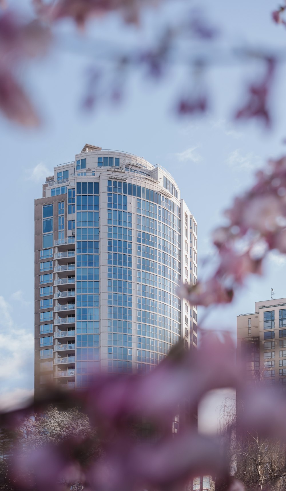 a tall building with a lot of windows in front of it