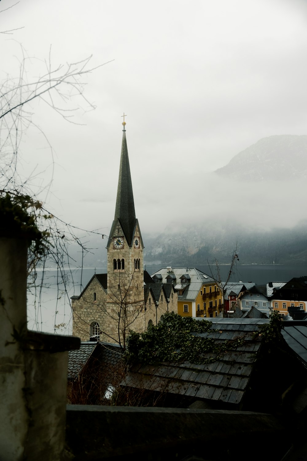 a church with a steeple on a cloudy day