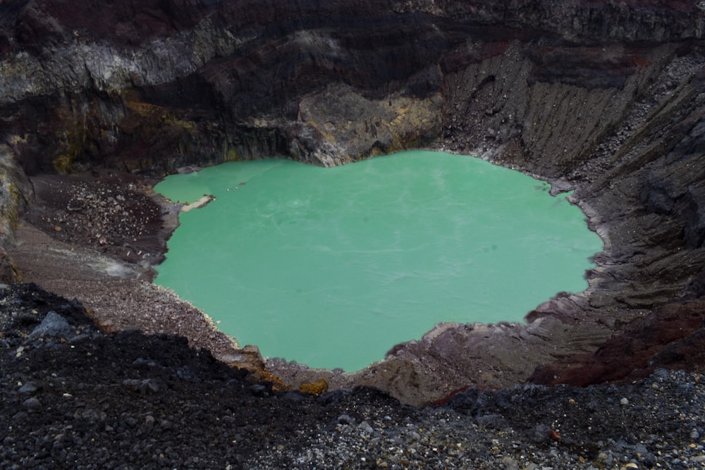 a heart shaped hole in the middle of a mountain