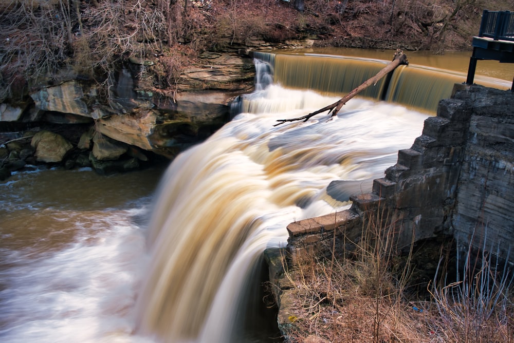 a large waterfall with water coming out of it