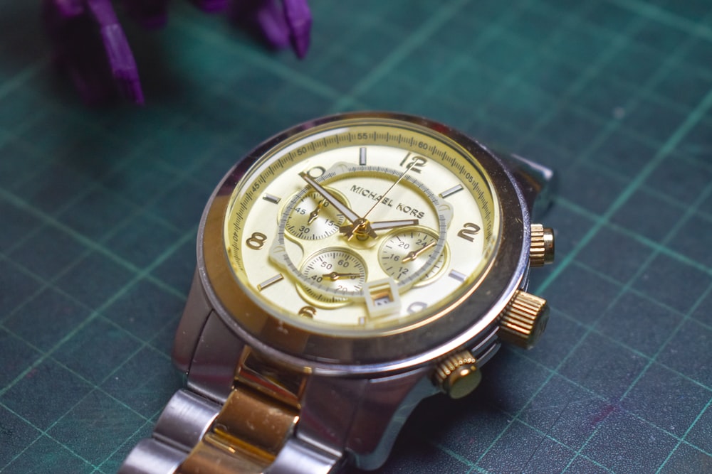 a close up of a watch on a table