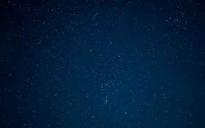 A serene image of celestial stars and planets aligning in the night sky.