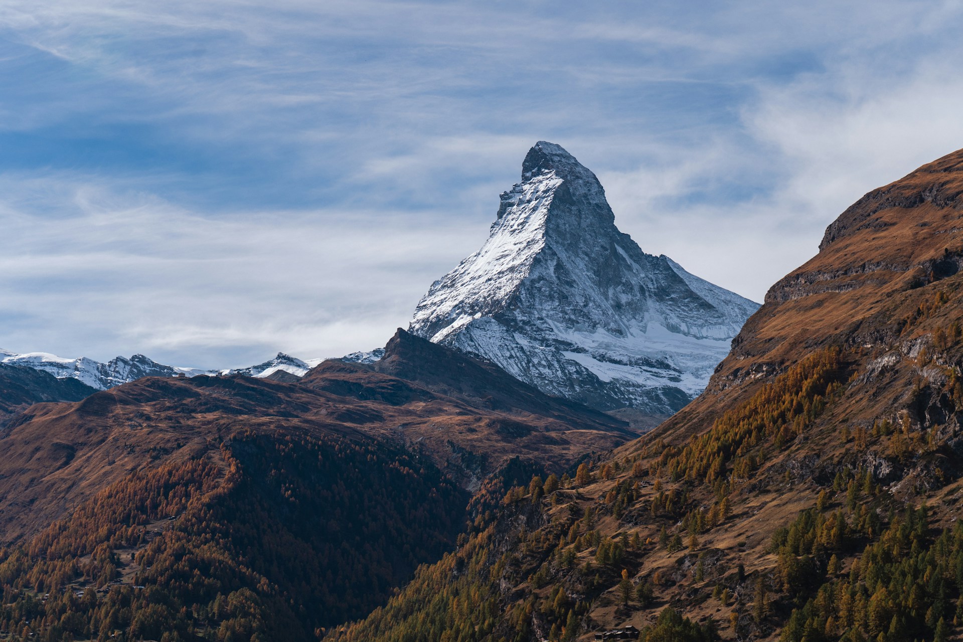 a mountain with a snow capped peak in the distance