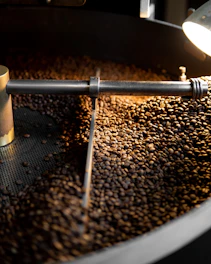 a machine that is making coffee beans