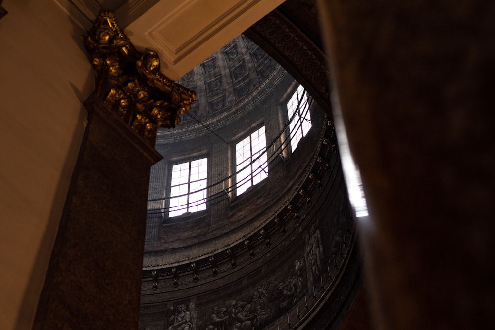 looking up at the ceiling of a large building