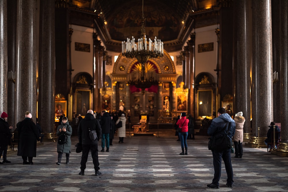 a group of people standing inside of a church