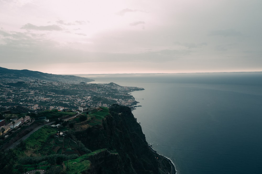 an aerial view of a city on the edge of a cliff