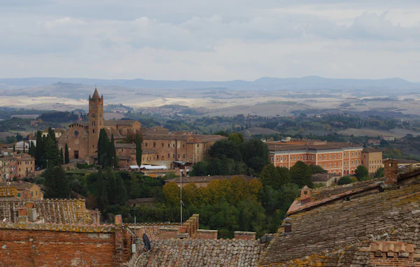 Siena's church towers and rooftops overlooking the Tuscan countryside
