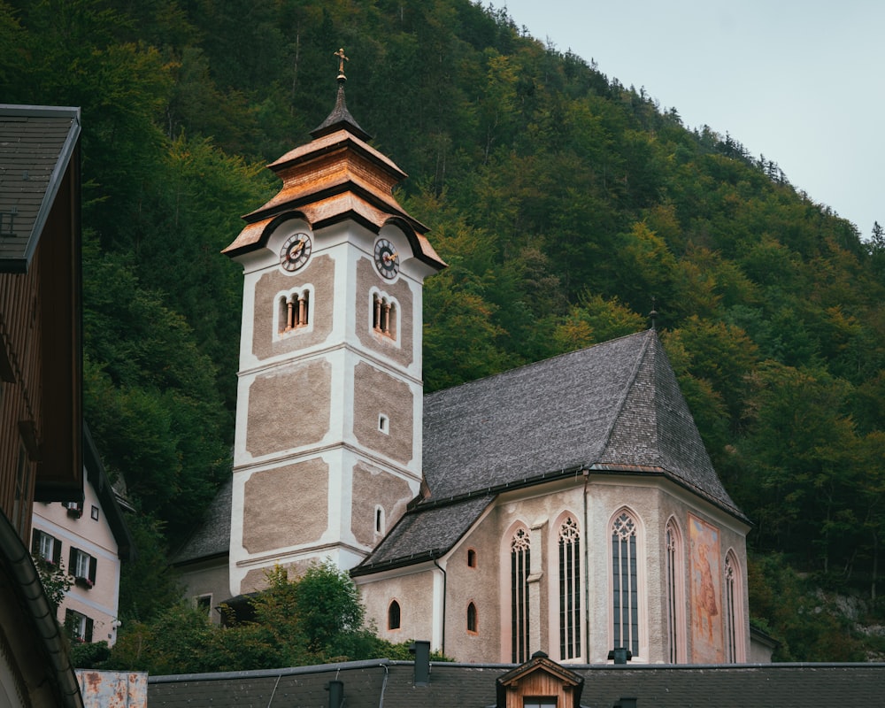 a church with a steeple and a steeple with a clock on it