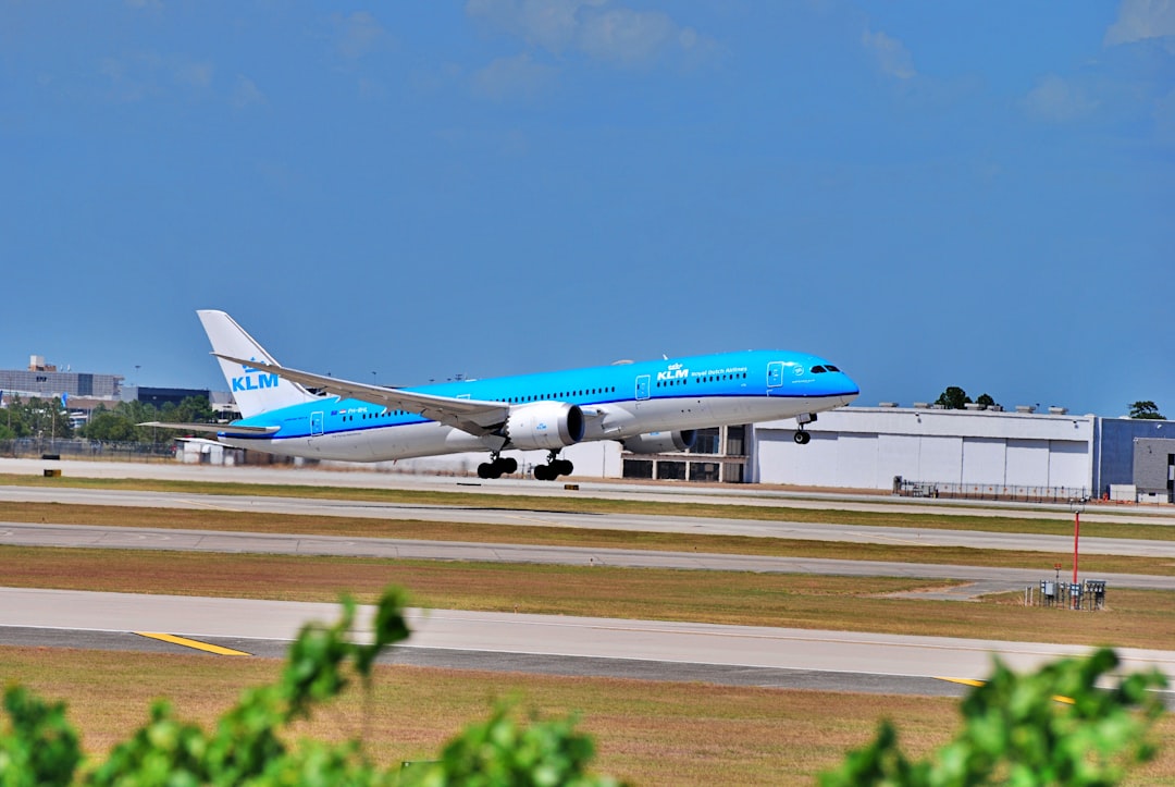 a blue and white airplane is on the runway, A KLM 787-9 Operating under KLM194 KIAH-EHAM
