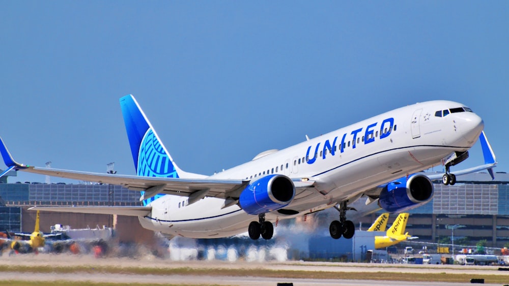 a large jetliner taking off from an airport runway