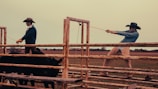 A team of cowboys and cowgirls working together.