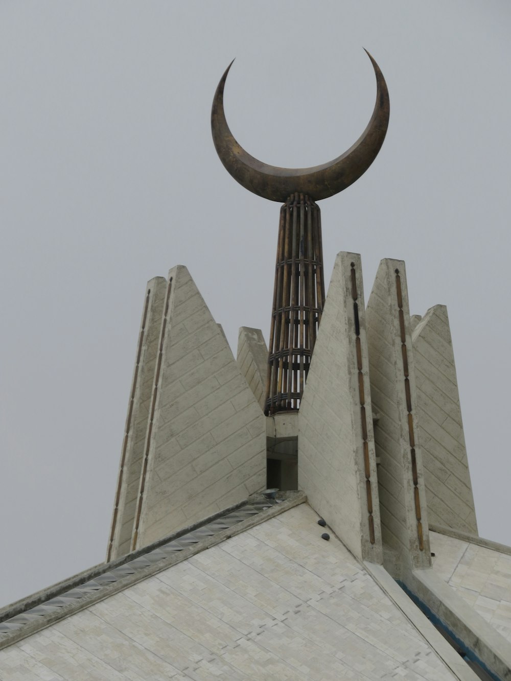 a sculpture of a bull's head on top of a building