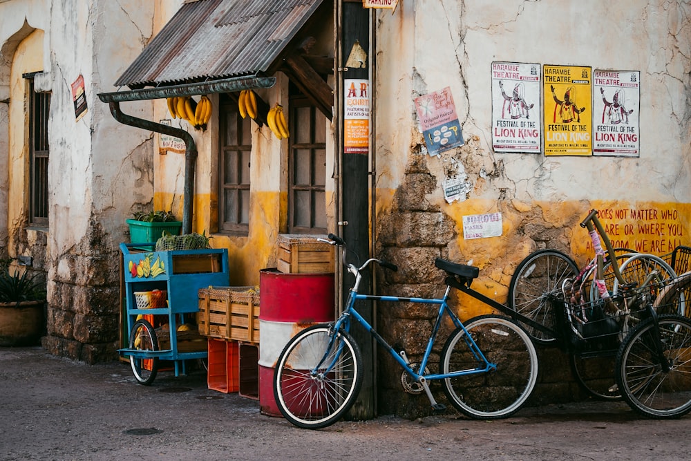 a couple of bikes parked next to a building