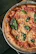 A close-up of a freshly baked Margherita pizza with bubbling cheese and basil.