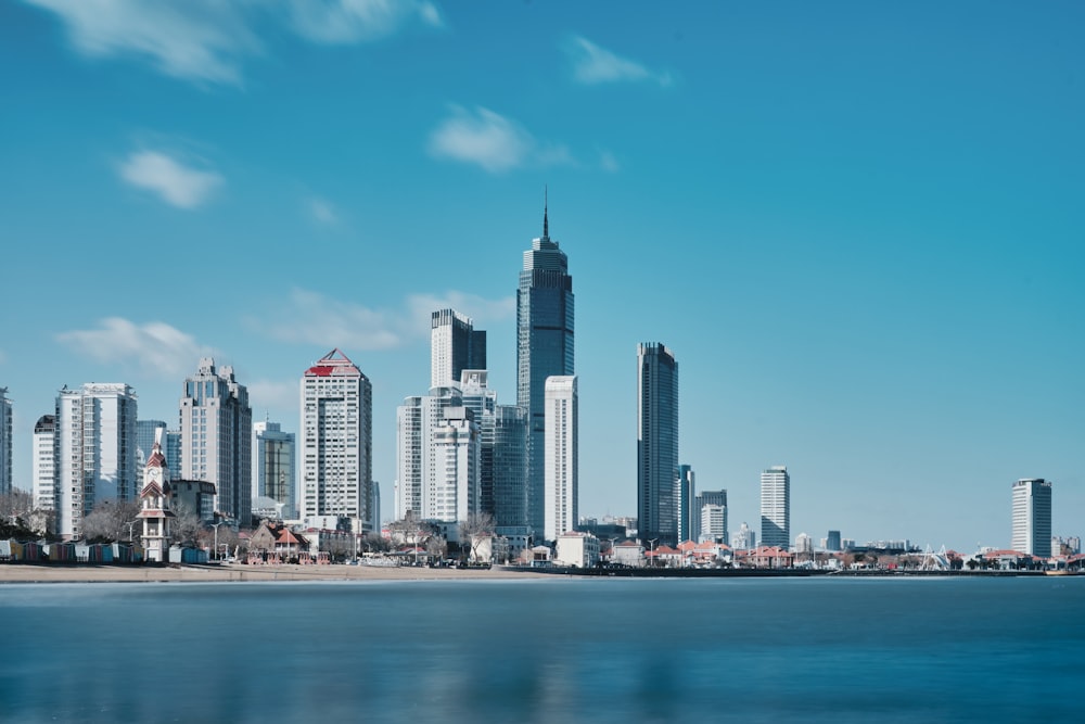 a view of a city with a body of water in front of it