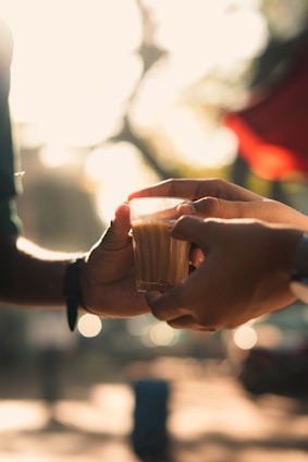 A warm, inviting scene of two families meeting over tea, symbolizing connection and tradition.