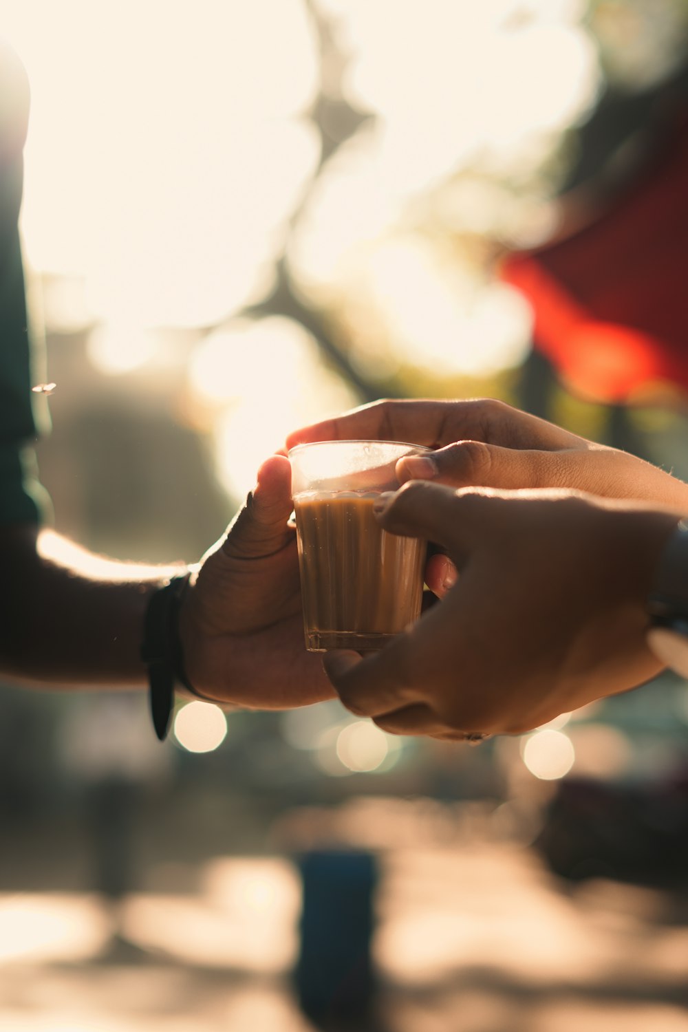 a couple of people that are holding a cup