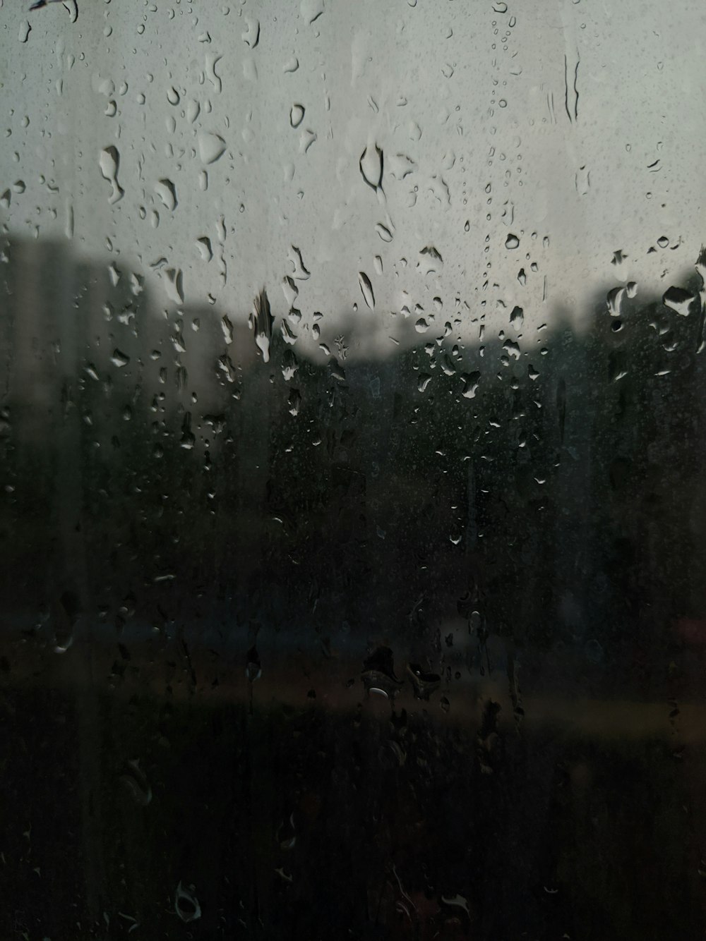 a window with rain drops on it