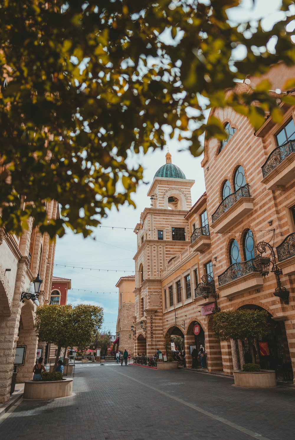 a city street with a clock tower in the background