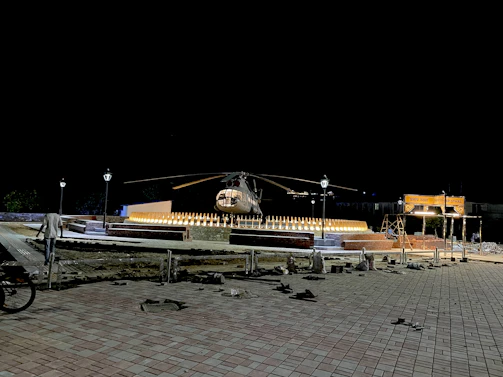 Close-up of a helipad's safety lighting system glowing at dusk.