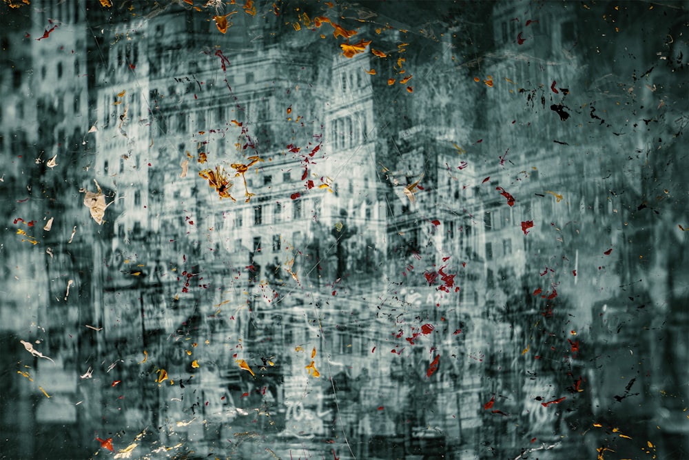 a painting of a city with buildings and leaves