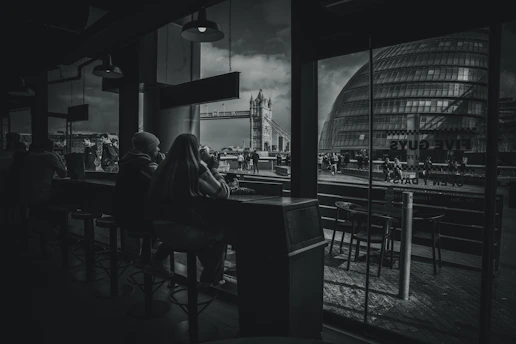 A quiet Lithuanian café where locals engage in thoughtful conversation over coffee.