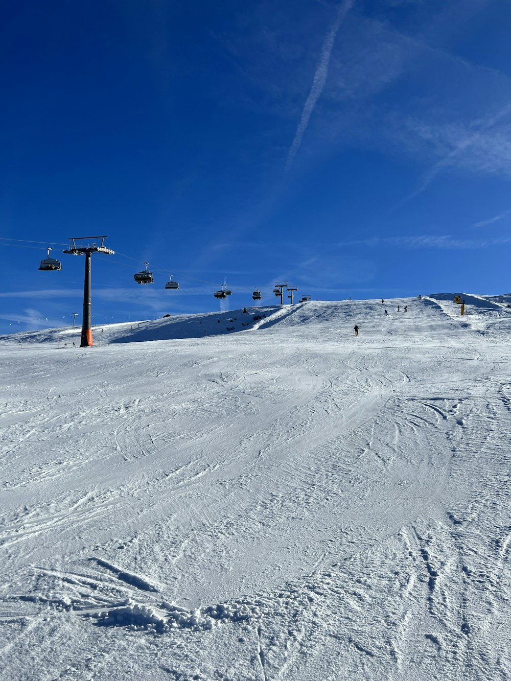 a person riding skis down a snow covered slope