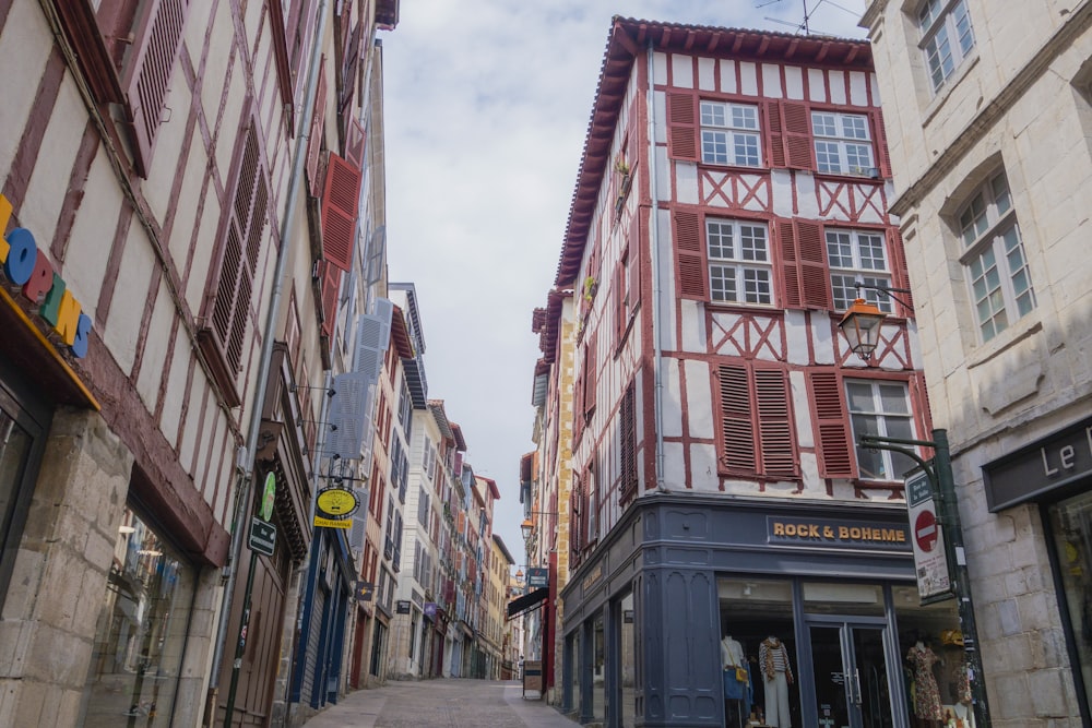 a narrow city street lined with tall buildings