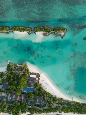 an aerial view of a resort on a tropical island