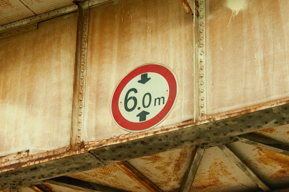 a close up of a sign on a bridge