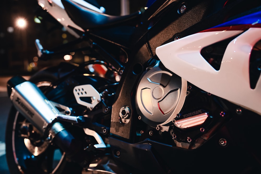 a close up of a motorcycle parked at night
