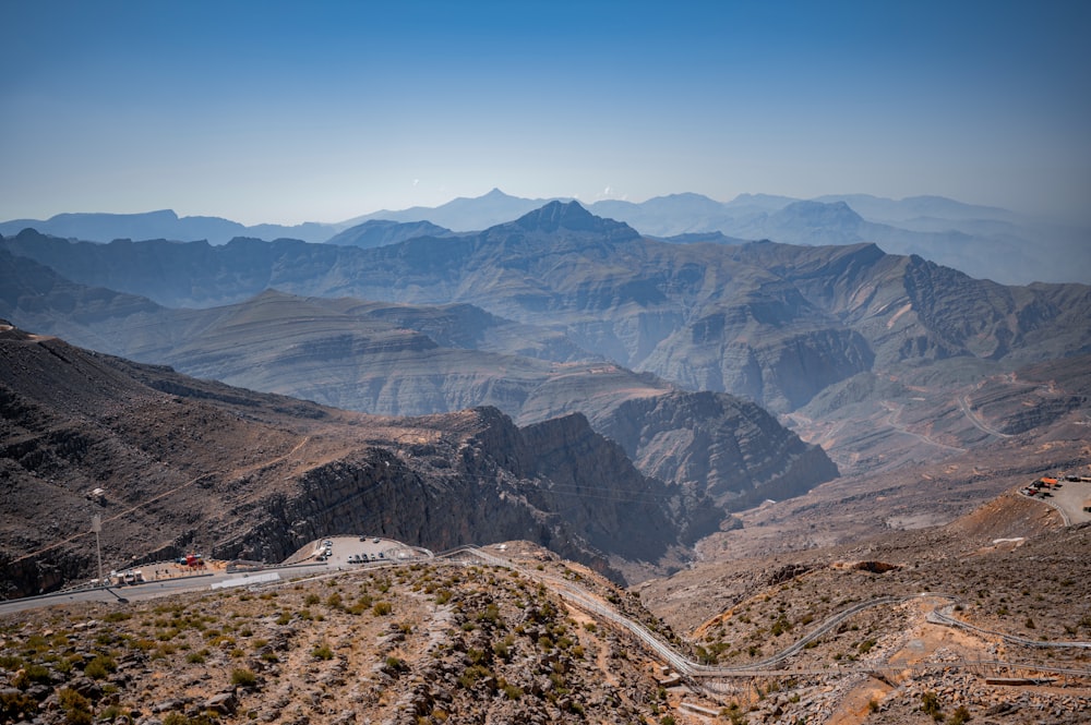 a scenic view of mountains and a road