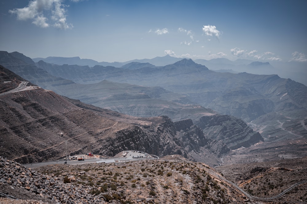 a scenic view of mountains and a road