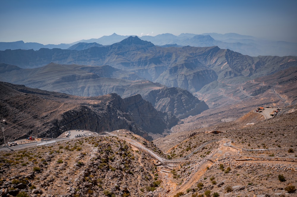 a scenic view of mountains and roads in the desert