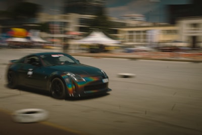 A fast-paced racing game screen with realistic cars zooming on a city track.