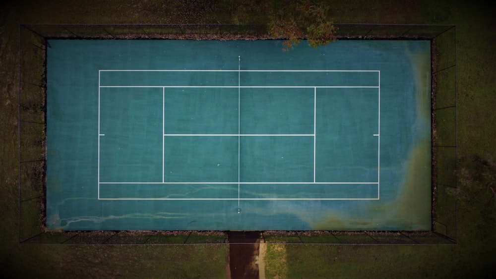 an aerial view of a tennis court in the middle of nowhere