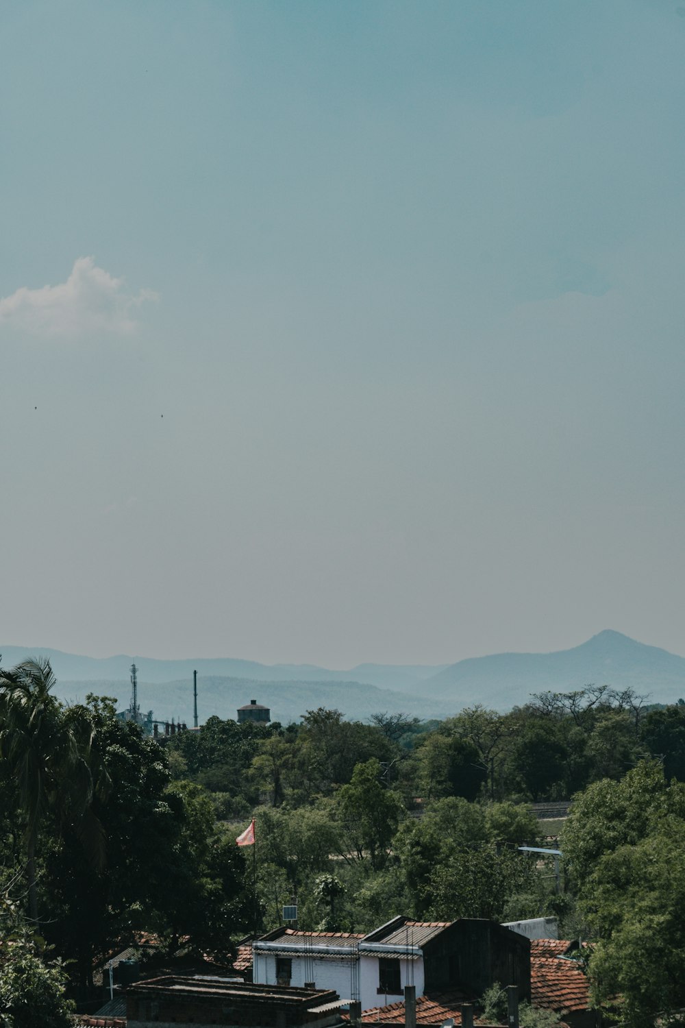 a view of a town with mountains in the background