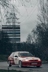 Vehicle branded with colorful advertising decals parked on street