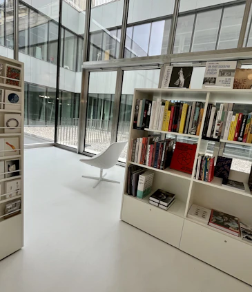 A modern, clean library space with philosophical books and a serene atmosphere.