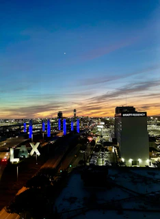 A vibrant Los Angeles skyline at dusk seen through a spotless, freshly cleaned office carpet in downtown LA.