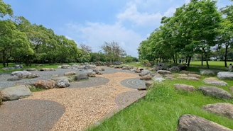 A serene public park in Kobe designed with natural stone pathways and native plants.