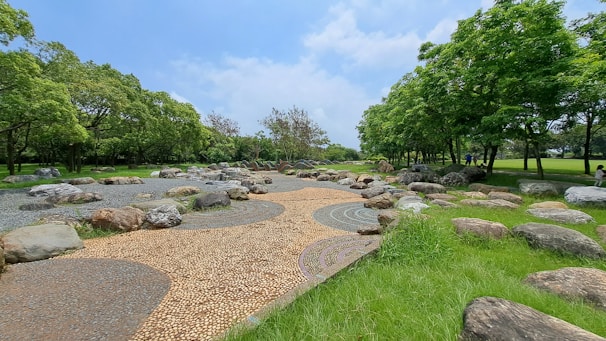 A serene public park in Kobe designed with natural stone pathways and native plants.