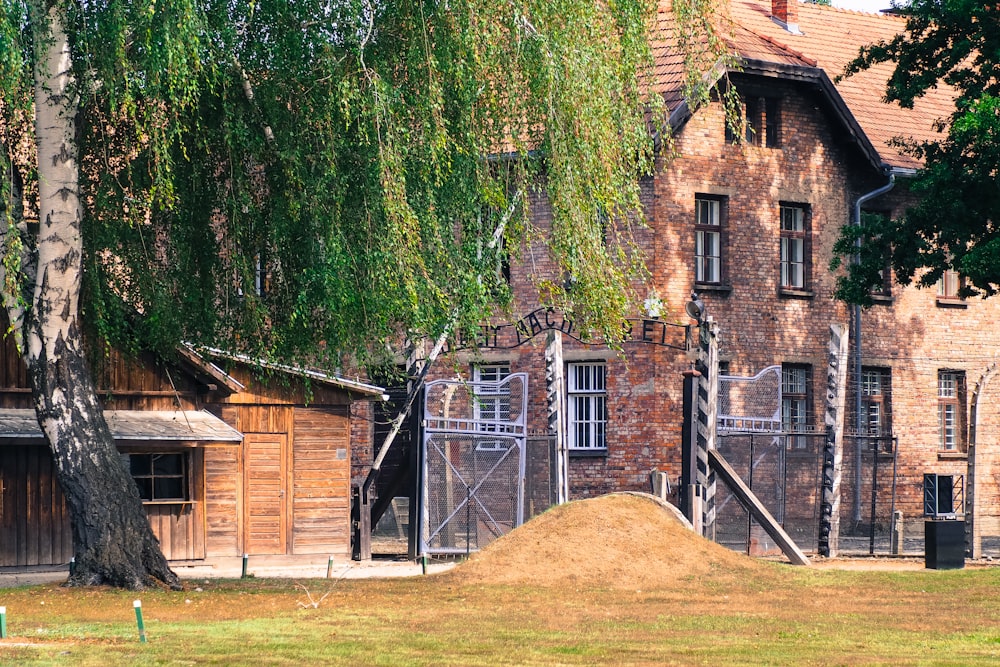 a large pile of dirt sitting in front of a building