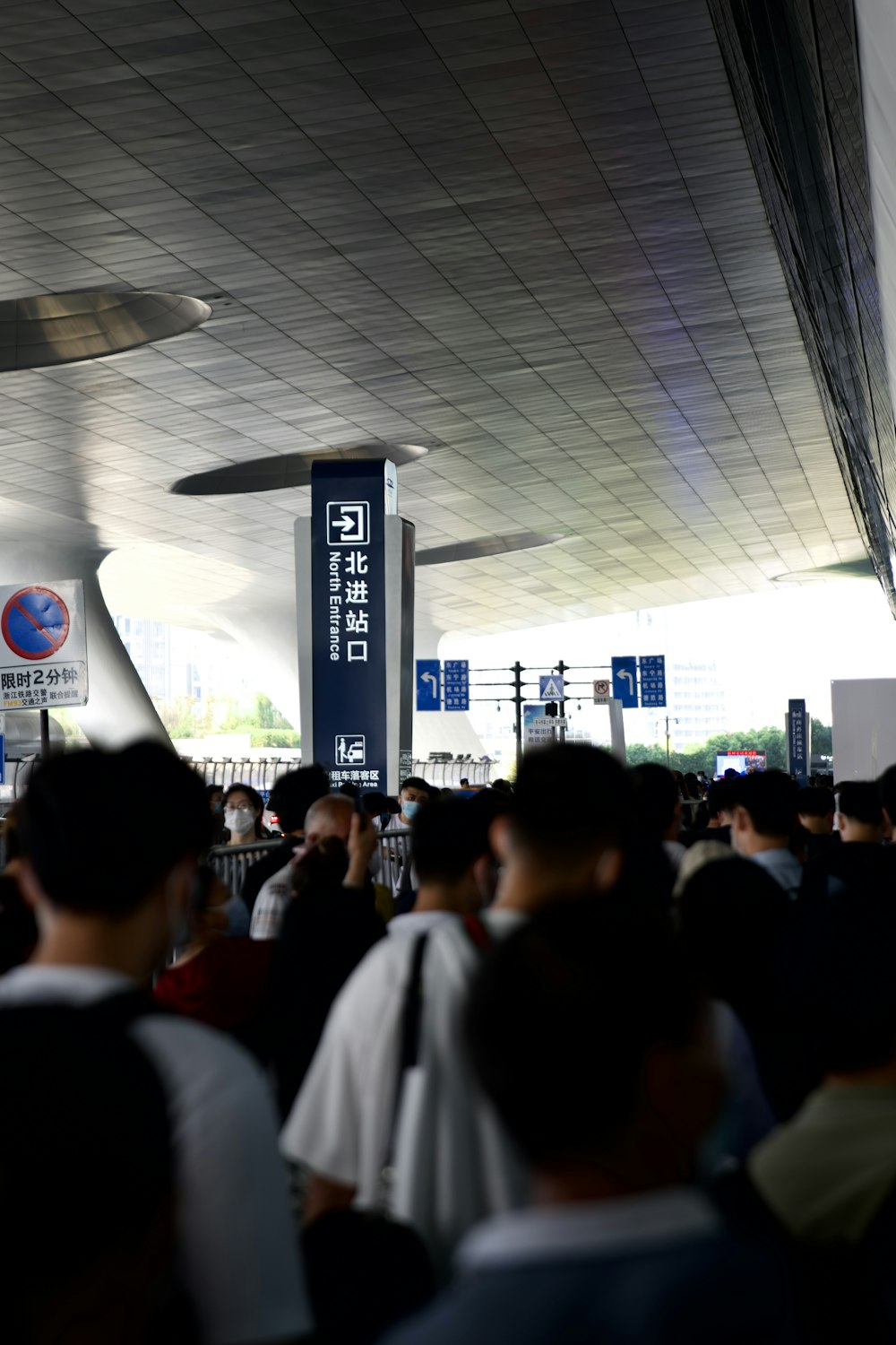 a crowd of people standing around a terminal