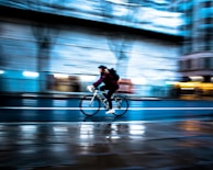 A dynamic shot of a cyclist dressed in Lumina activewear, blending style and function on city bike lanes.