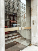 A smart door system integrated into a stylish office entrance with glass panels.