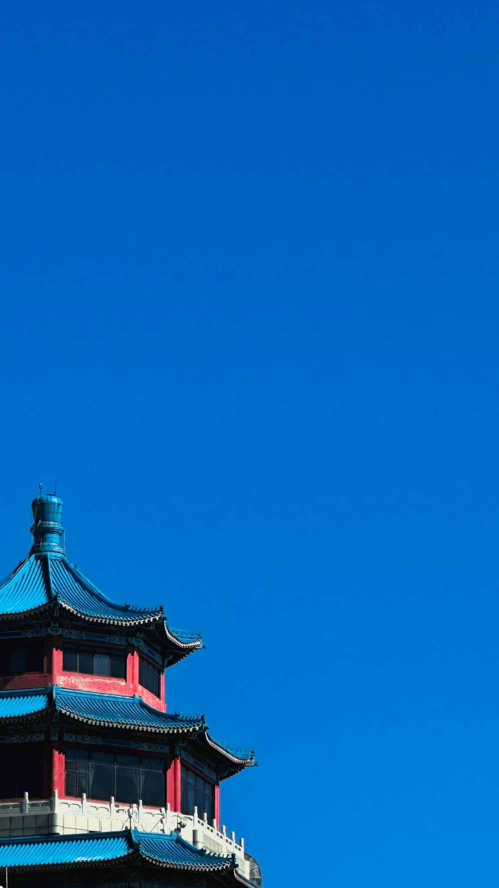 a tall tower with a clock on the top of it