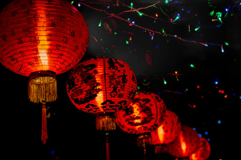 chinese lanterns lit up in the night sky